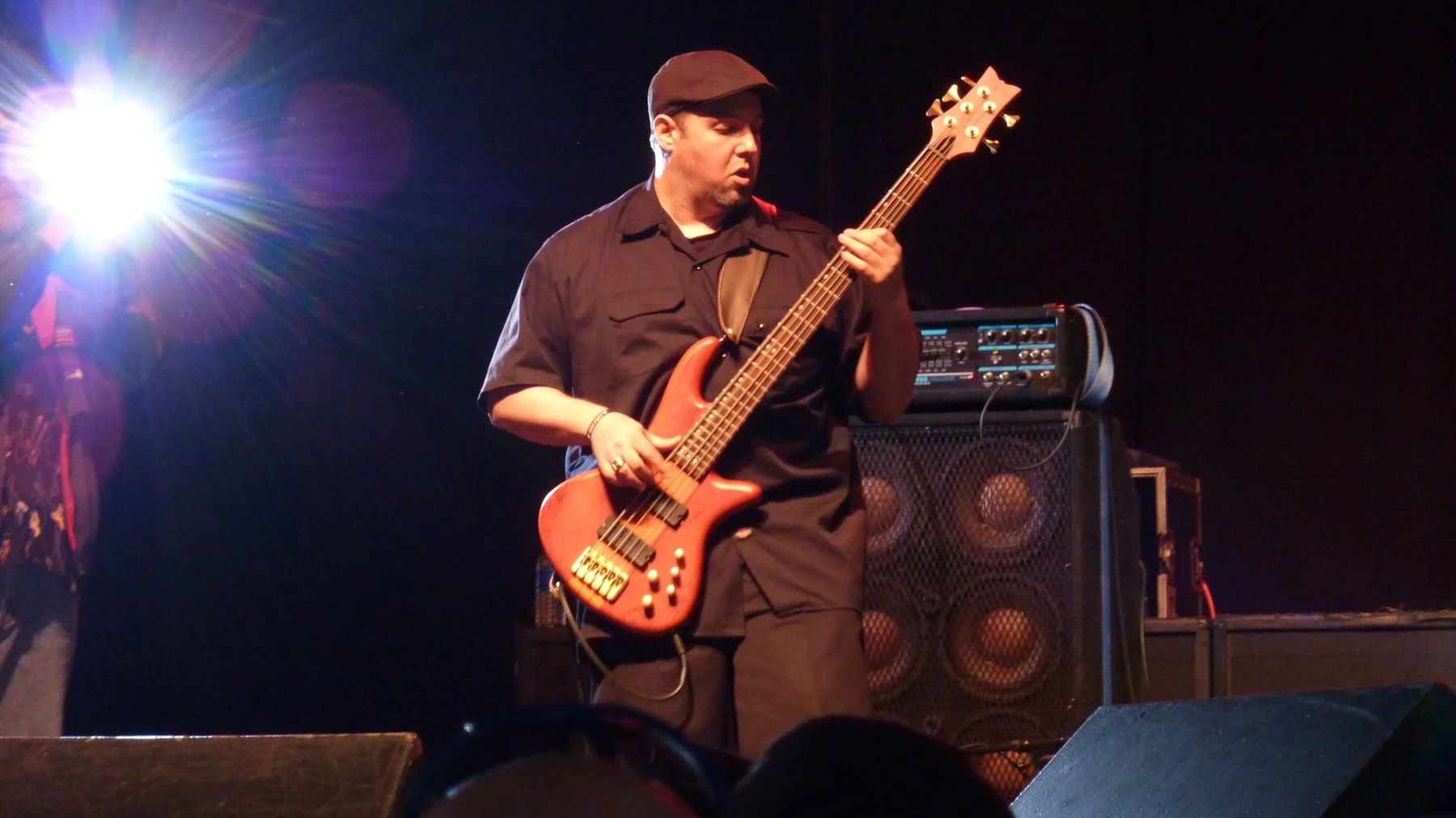 Jim DeGrandis performing on bass guitar